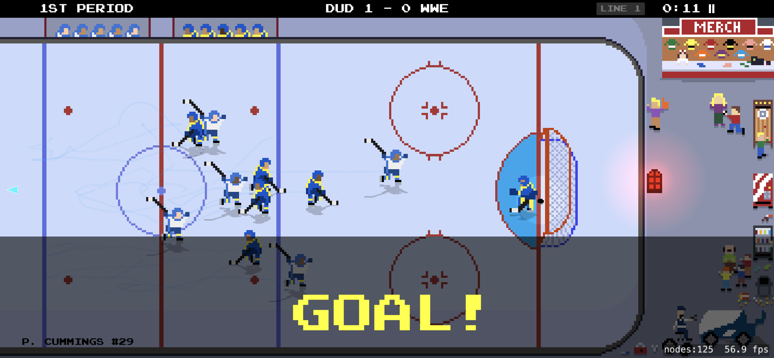Goal celebration in front of the net as the crowd cheers